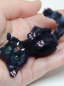 Miniature black cat